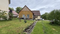 Freistehendes Wohnhaus mit ehemaligem Ökonomieteil - Gartenansicht